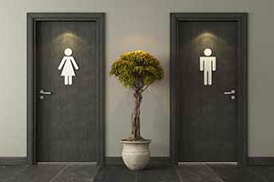 Doors of men and women's commercial bathrooms. Commercial Plumbing Repair in Portland OR and Vancouver WA by D & F Plumbing