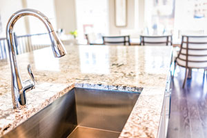 Close up of kitchen counter and kitchen sink. D & F Plumbing provides quality kitchen drain cleaning services in Portland OR and Vancouver WA.