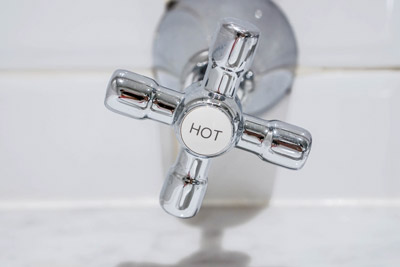 Hot water faucet handle. D&F Plumbing, Heating and Cooling sells, installs, and repairs conventional water heaters in Portland OR and Vancouver WA.