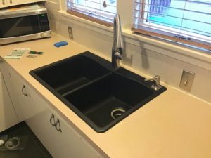 Black kitchen sink. D & F Plumbing provides kitchen sink installation services for homeowners in Portland OR and Vancouver WA.