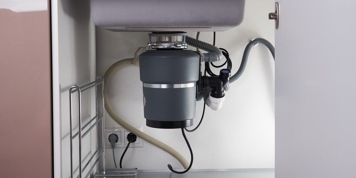 Garbage disposal unit under sink. D&F Plumbing, Heating and Cooling talks about signs you need your drains cleaned in Portland OR & Vancouver WA