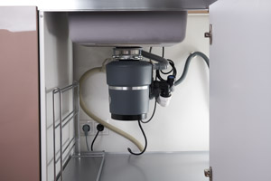 Garbage disposal unit under sink. D & F Plumbing talks about signs you need your drains cleaned in Portland OR & Vancouver WA
