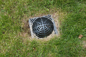 Catch basin in lawn. D&F Plumbing, Heating and Cooling in Portland OR & Vancouver WA talks about how to drain water from your yard.