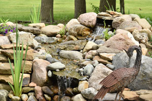 Backyard water feature. D & F Plumbing in Portland OR & Vancouver WA offers tips for adding a backyard water feature.