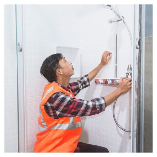 plumber working in shower