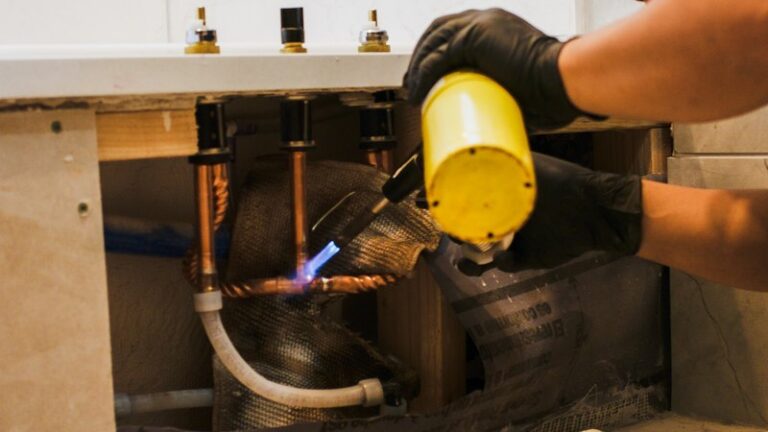D&F technician soldering a joint, close up