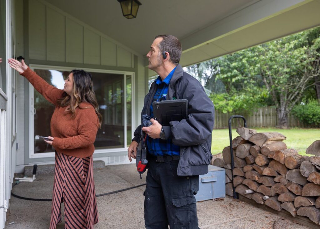 D&F technician reviewing a home inspection with the homeowner