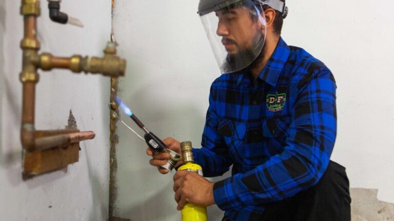 D&F plumber soldering a copper water supply line